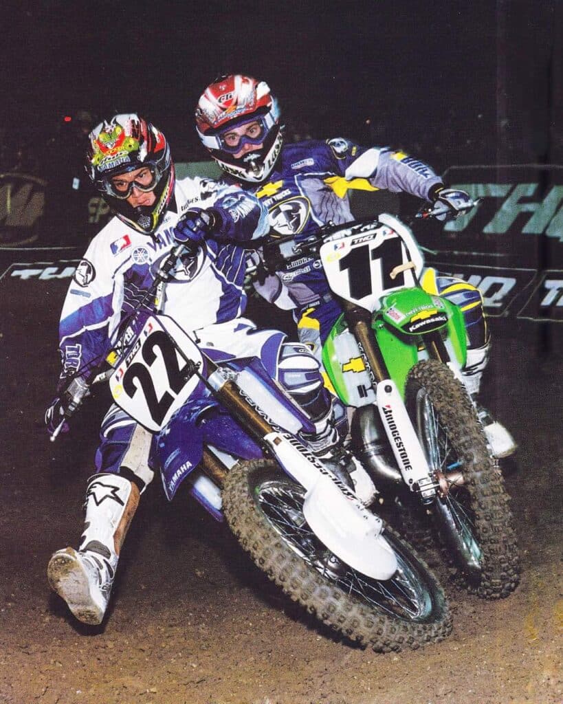 Rookie Chad Reed cuts under Ezra Lusk during the 2003 AMA Supercross season.