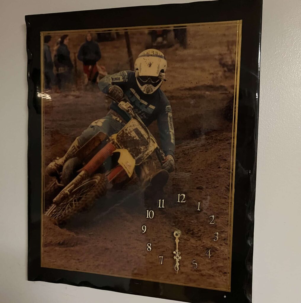 A clock featuring John Dowd in an NESC race, late 1980s.